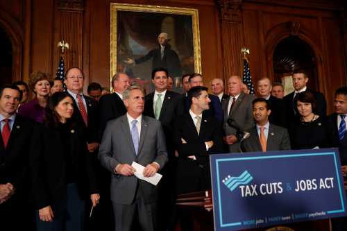 House Republicans including Speaker of the House Paul Ryan await the start of a news conference announcing the passage of the "Tax Cuts and Jobs Act" at the U.S. Capitol in Washington
