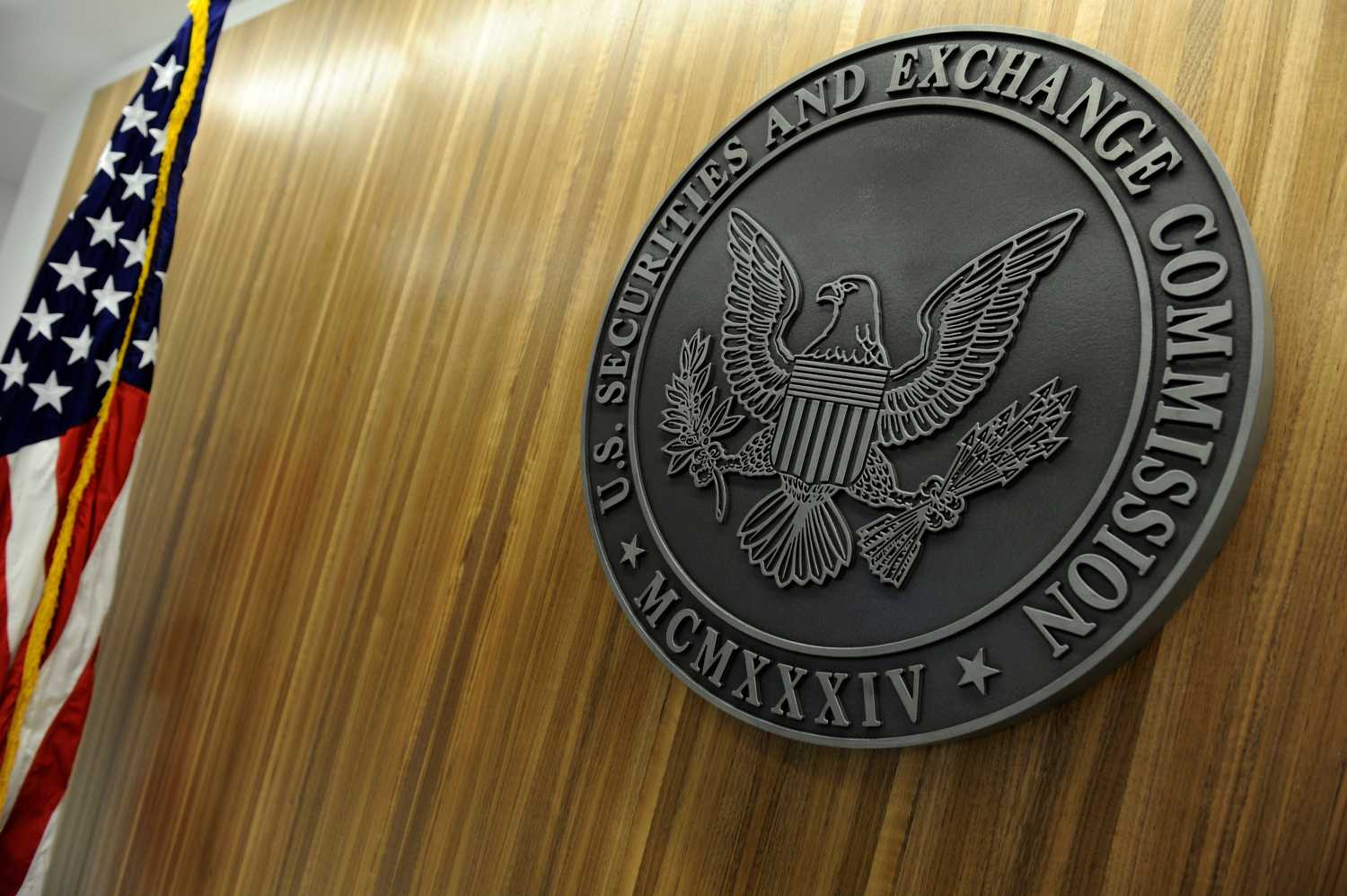 The seal of the U.S. Securities and Exchange Commission hangs on the wall at SEC headquarters.