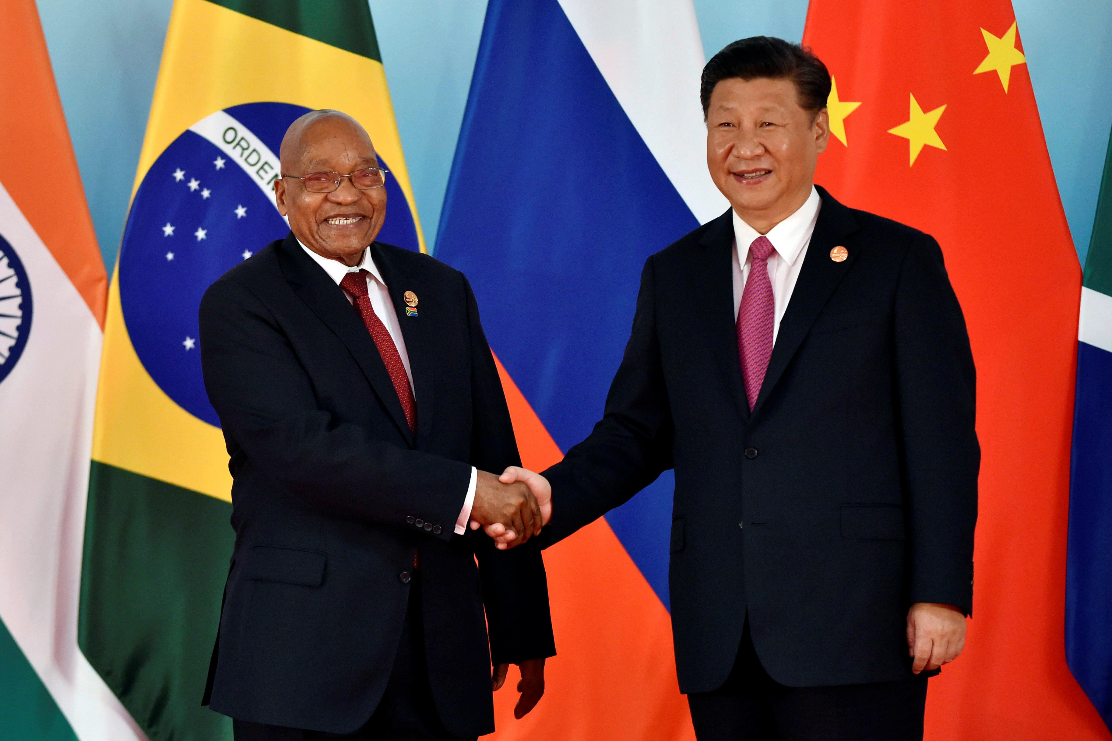 Chinese President Xi Jinping (R) and South Africa's President Jacob Zuma shake hands before the group photo during the BRICS Summit at the Xiamen International Conference and Exhibition Center in Xiamen, southeastern China's Fujian Province, China September 4, 2017. REUTERS/Kenzaburo Fukuhara/Pool - RC12CBC6B5B0