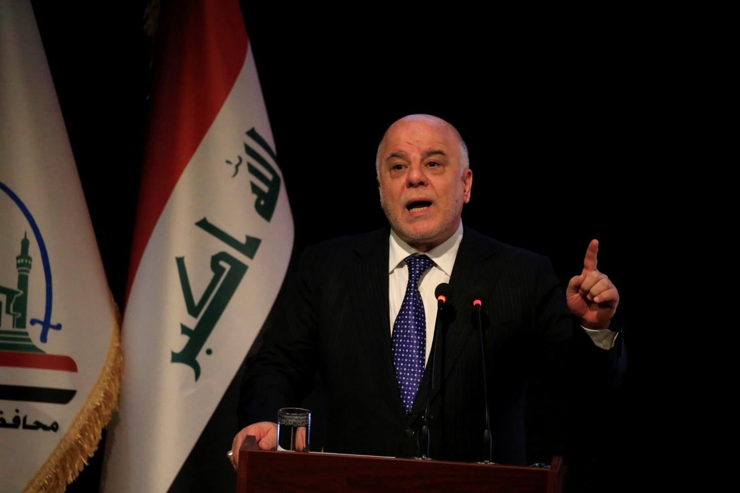 Iraq's Prime Minister Haider al-Abadi speaks during a ceremony in Najaf, Iraq January 7, 2018. REUTERS/Alaa Al-Marjani - RC14AC3641E0