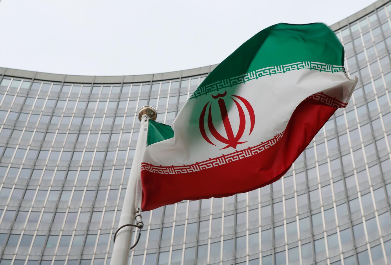 An Iranian flag flutters in front of the International Atomic Energy Agency (IAEA) headquarters in Vienna, Austria, January 15, 2016. REUTERS/Leonhard Foeger - LR2EC1F0Z4WIW