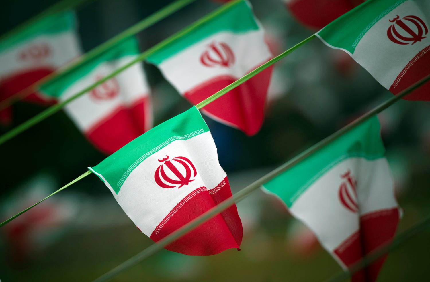 FILE PHOTO: Iran's national flags are seen on a square in Tehran
