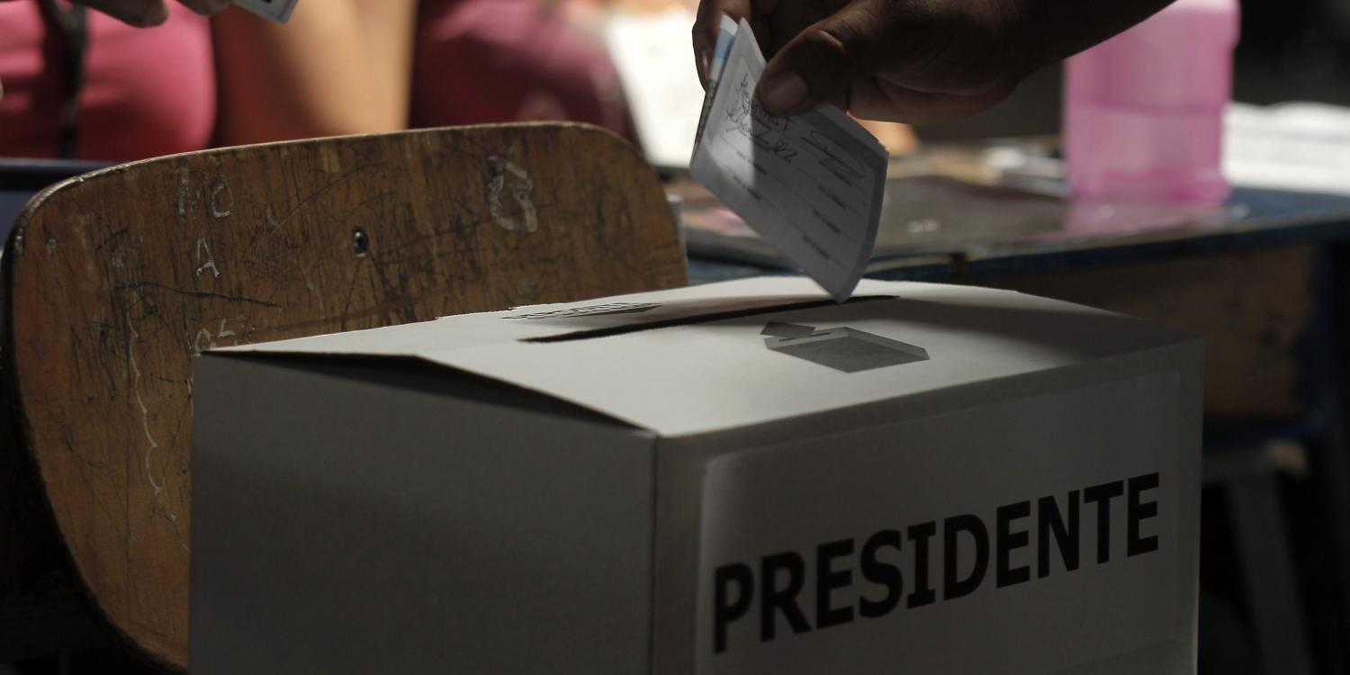 A voter casts a vote at a polling station during Costa Rica's presidential election run-off in San Jose April 6, 2014. A centre-left academic who has never been elected to office is expected to cruise to victory in Costa Rica's presidential election run-off on Sunday after his ruling party rival pulled out. Solis, a former diplomat, rode a wave of anti-government sentiment over rising inequality and corruption scandals to finish ahead in a first round of voting in February, surprising pollsters who had placed him fourth. REUTERS/Juan Carlos Ulate (COSTA RICA - Tags: POLITICS) - GM1EA470DQC01