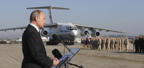 FILE PHOTO: Russian President Vladimir Putin addresses servicemen as he visits the Hmeymim air base in Latakia Province, Syria December 11, 2017. Sputnik/Mikhail Klimentyev/Sputnik via REUTERS ATTENTION EDITORS - THIS IMAGE WAS PROVIDED BY A THIRD PARTY/File Photo - RC13F85C4140
