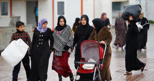Syrian refugee women walk in Elbeyli refugee camp near the Turkish-Syrian border in Kilis province, Turkey, December 1, 2016. REUTERS/Umit Bektas - RC1217CCDAC0