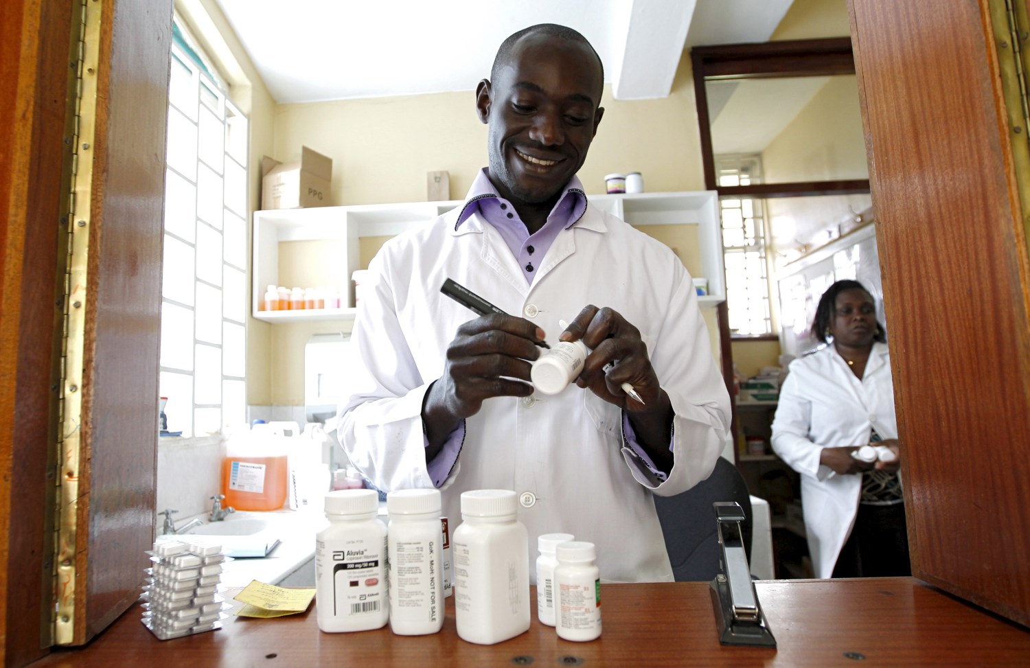 Michael Otieno, a pharmacist, dispenses anti-retroviral (ARV) drugs at the Mater Hospital in Kenya's capital Nairobi