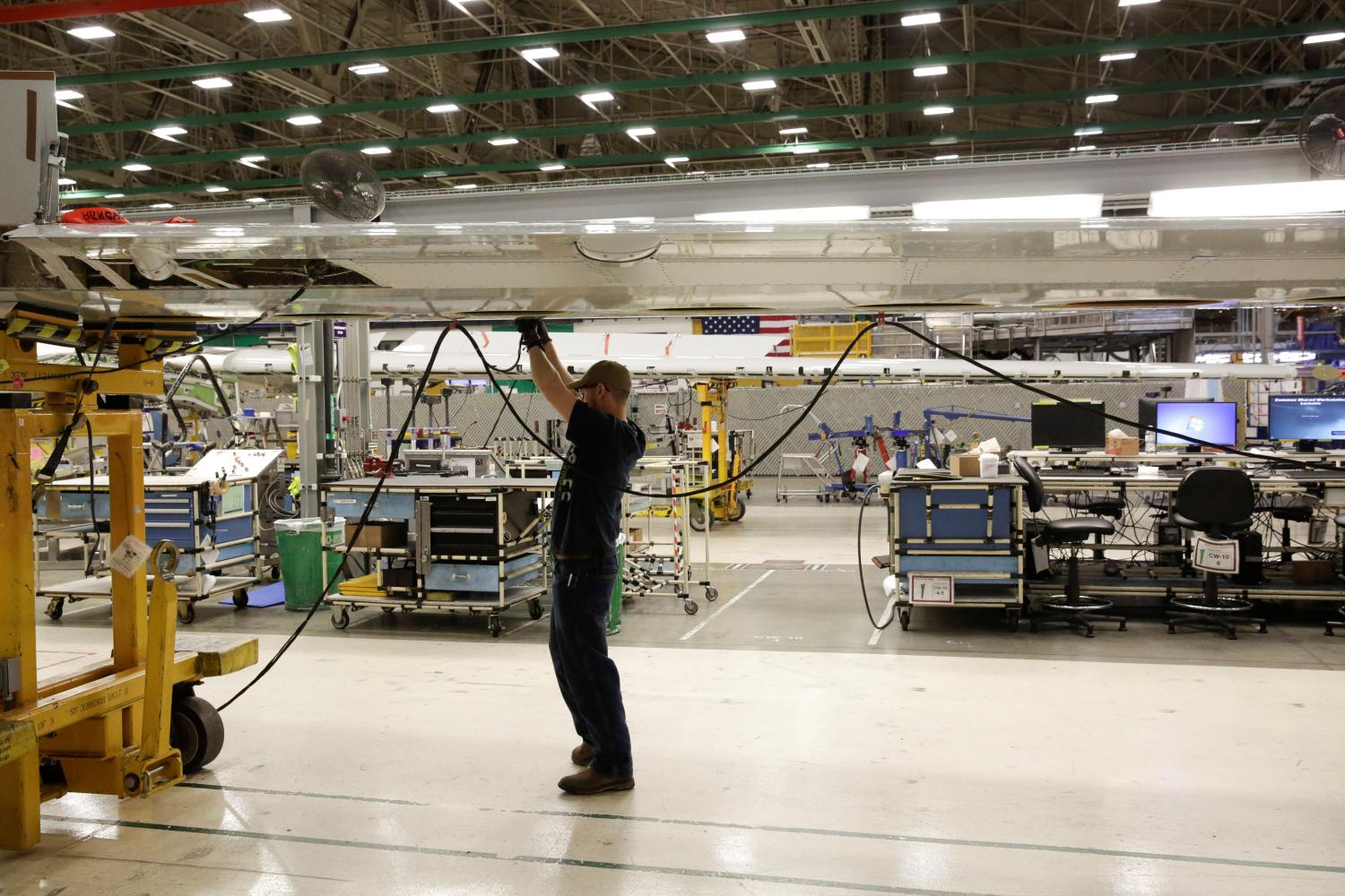 A Boeing worker is pictured in the wing system installation area at their factory in Renton, Washington.