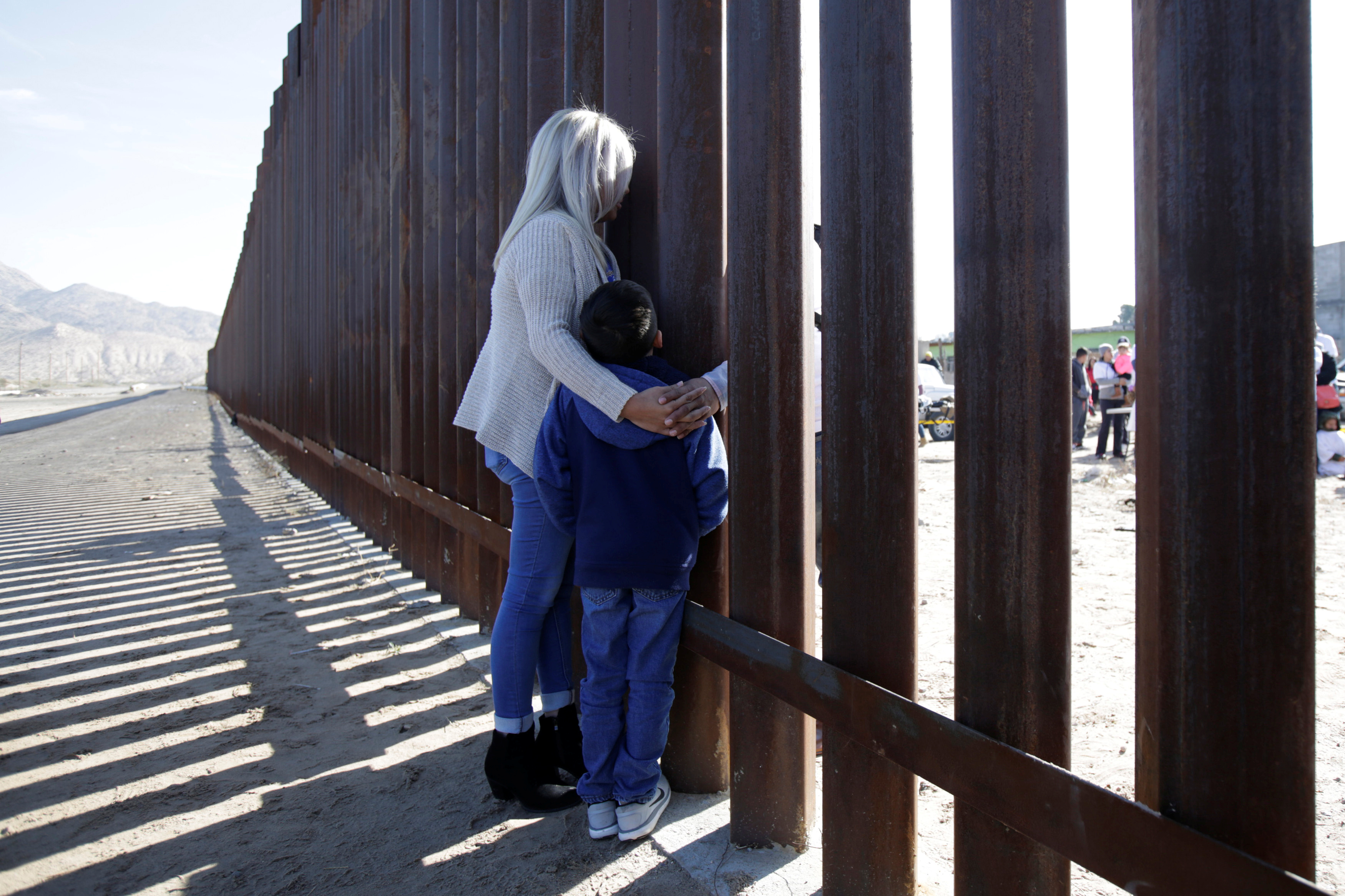 'Dreamers' speak with relatives during the 'Keep Our Dream Alive' binational meeting at a new section of the border wall on the U.S.-Mexico border.