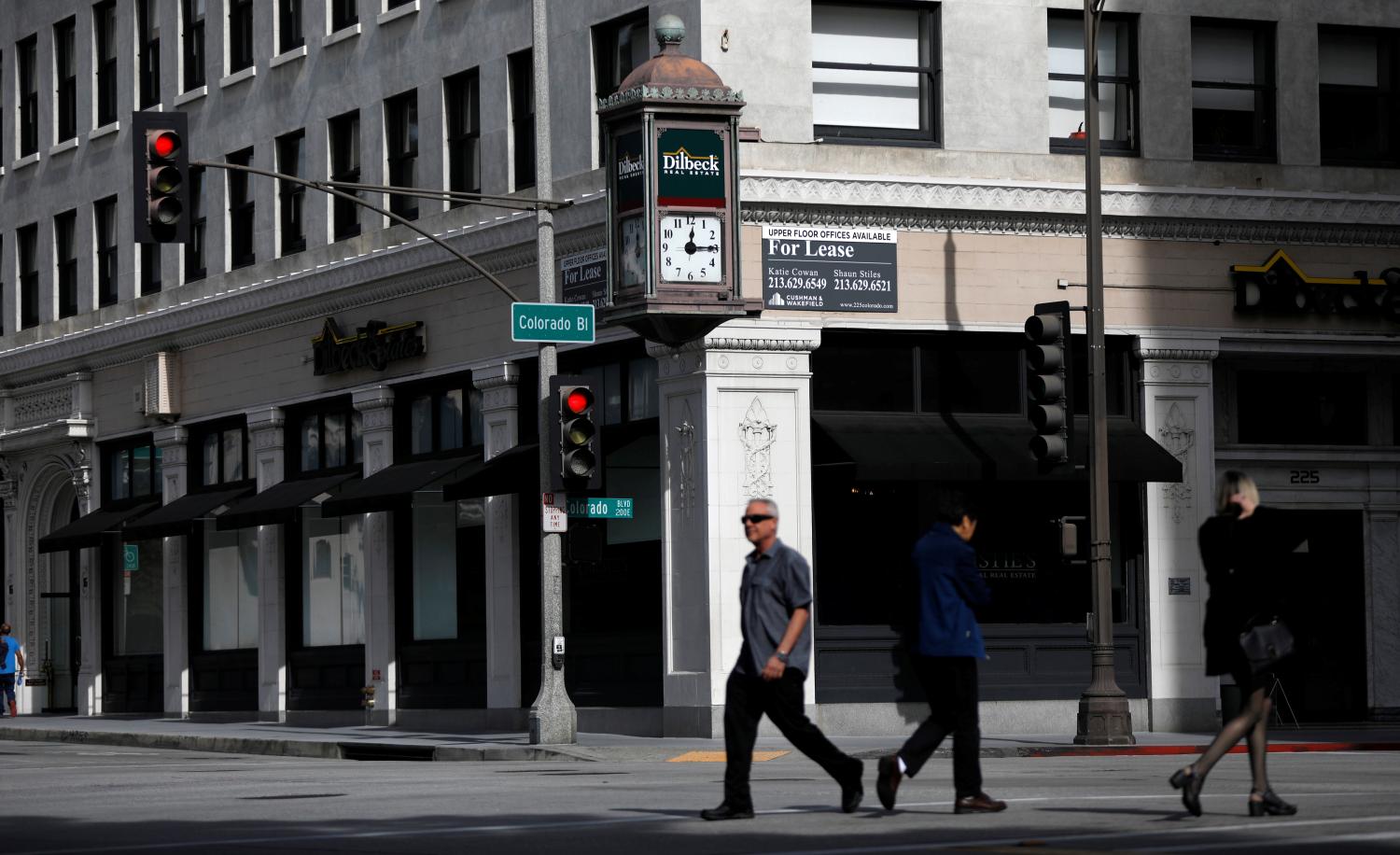 Pedestrians cross the street.