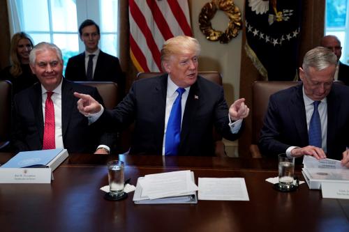 U.S. President Donald Trump, flanked by Secretary of State Rex Tillerson and Defense Secretary James Mattis, holds a cabinet meeting at the White House in Washington, U.S., December 20, 2017. REUTERS/Jonathan Ernst - RC1DDF673470