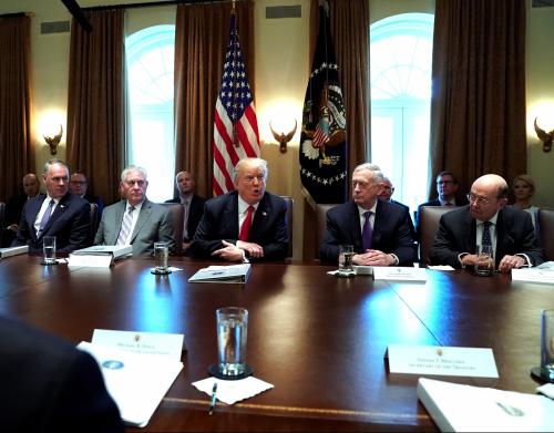 U.S. President Donald Trump, flanked by Interior Secretary Ryan Zinke, Secretary of State Rex Tillerson, Defense Secretary James Mattis and Commerce Secretary Wilbur Ross, holds a cabinet meeting at the White House in Washington, D.C.