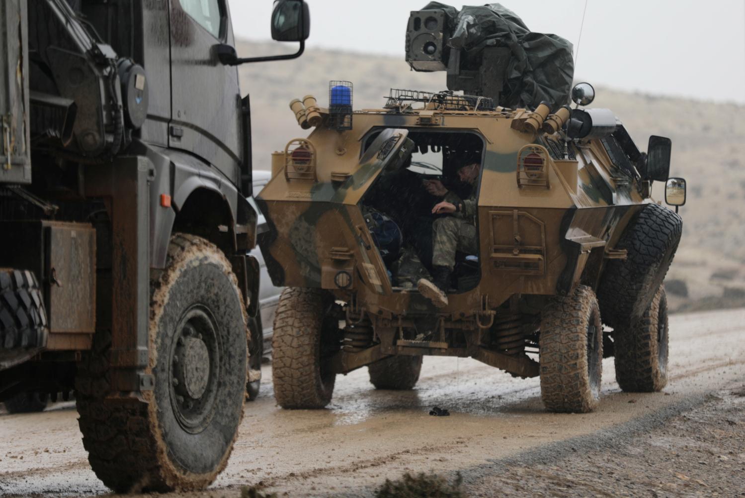 Turkish forces are seen near Mount Barsaya, northeast of Afrin, Syria January 23, 2018. REUTERS/Khalil Ashawi - RC1746F95990