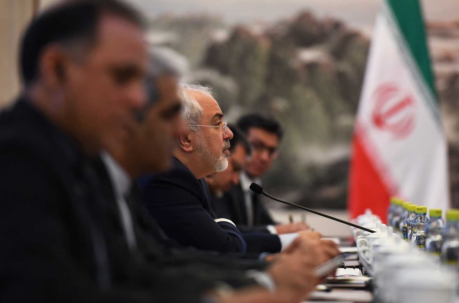 Iranian Foreign Minister Mohammad Javad Zarif (C) speaks during a meeting with Chinese Foreign Minister Wang Yi in Beijing on December 5, 2016. REUTERS/Greg Baker/Pool - RC15E01E0180