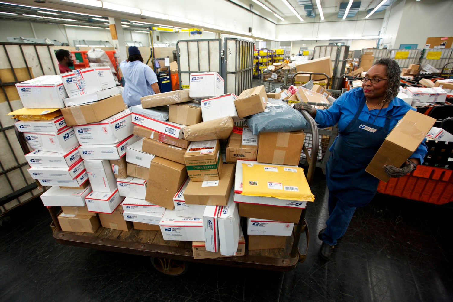 United States Postal Service clerks sort mail at the USPS Lincoln Park Carriers Annex in Chicago