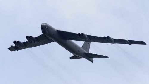FILE PHOTO: A Boeing B-52 Stratofortress strategic bomber from the US Air Force Andersen Air Force Base in Guam performs a fly-over at the Singapore Airshow in Singapore February 14, 2012. REUTERS/Tim Chong/File Photo - TM3EC5I1NS201