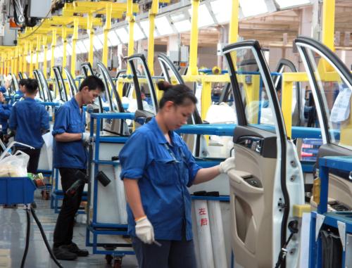 Employees work at a production line inside a factory of Saic GM Wuling, in Liuzhou, Guangxi Zhuang Autonomous Region, China, June 19, 2016. REUTERS/Norihiko Shirouzu - S1AETQJGBJAA