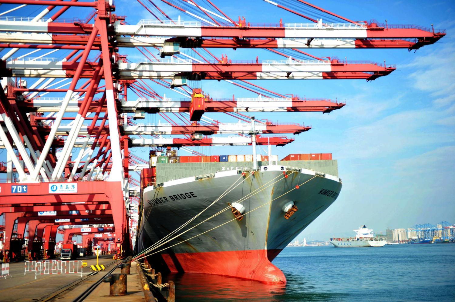 A ship loaded with container boxes is seen at a port in Qingdao, Shandong province, China October 13, 2017. REUTERS/Stringer