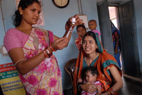 Community_health_worker_gives_a_vaccination_in_Odisha_state,_India_(8380317750)
