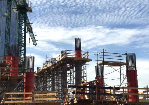 Workers are seen at a construction site .