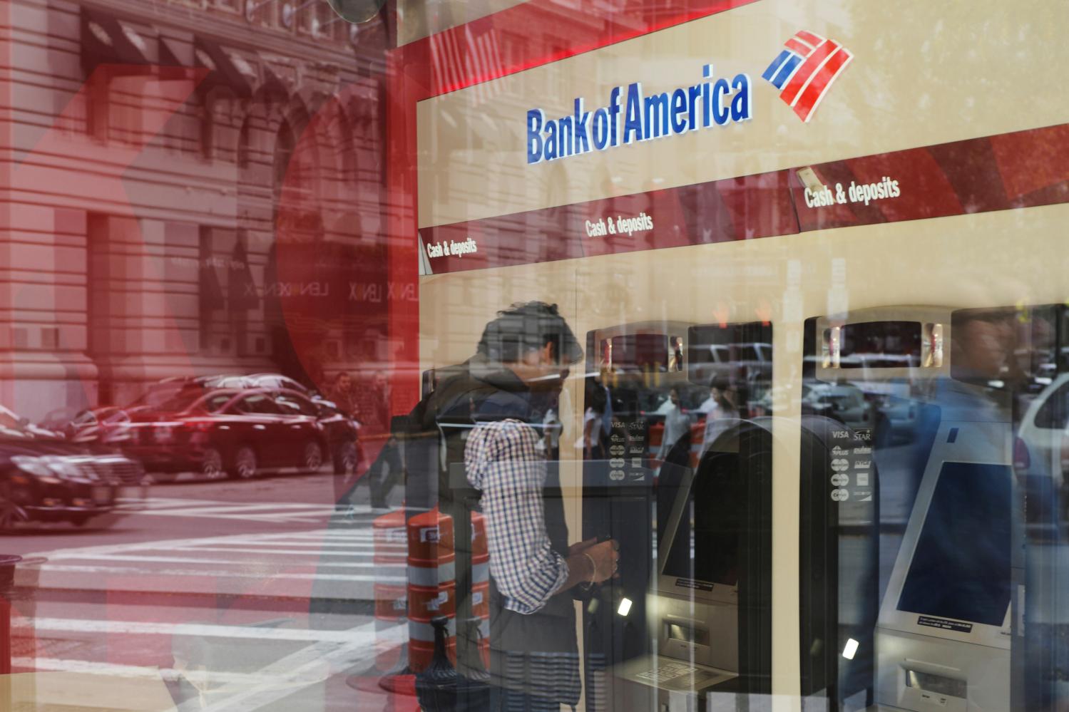 A customer uses an ATM at a Bank of America branch.