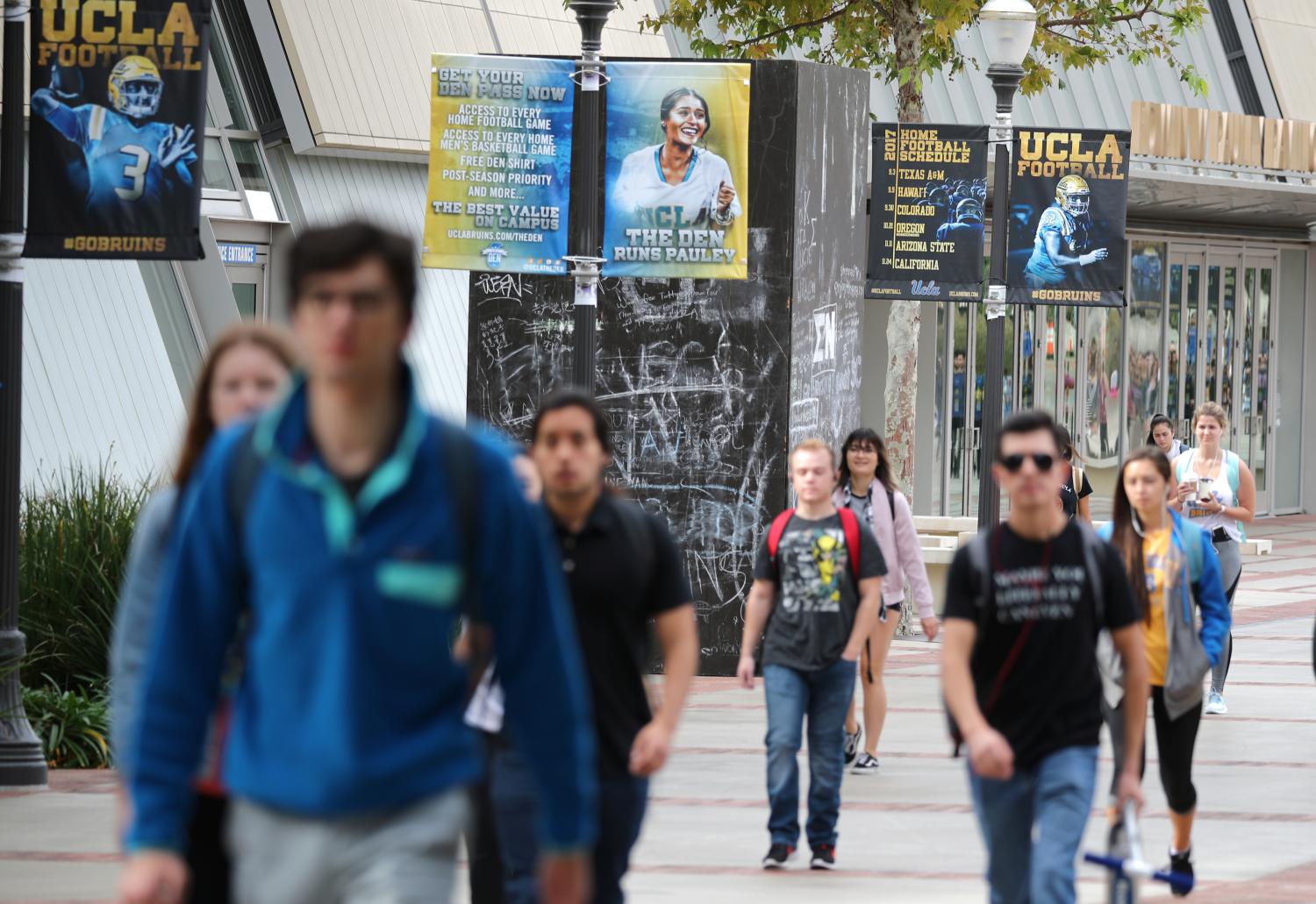 UCLA students walk outside the Pauley Pavilion basketball court.
