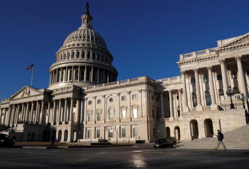 People walk by the U.S. Capitol building in Washington.