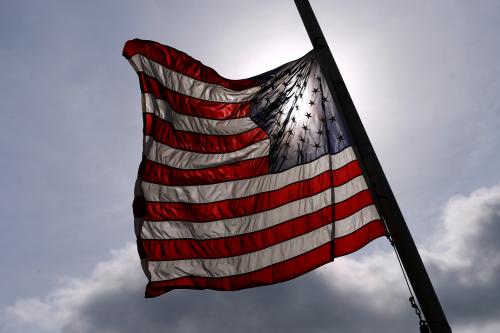 An American flag is seen at half-mast.