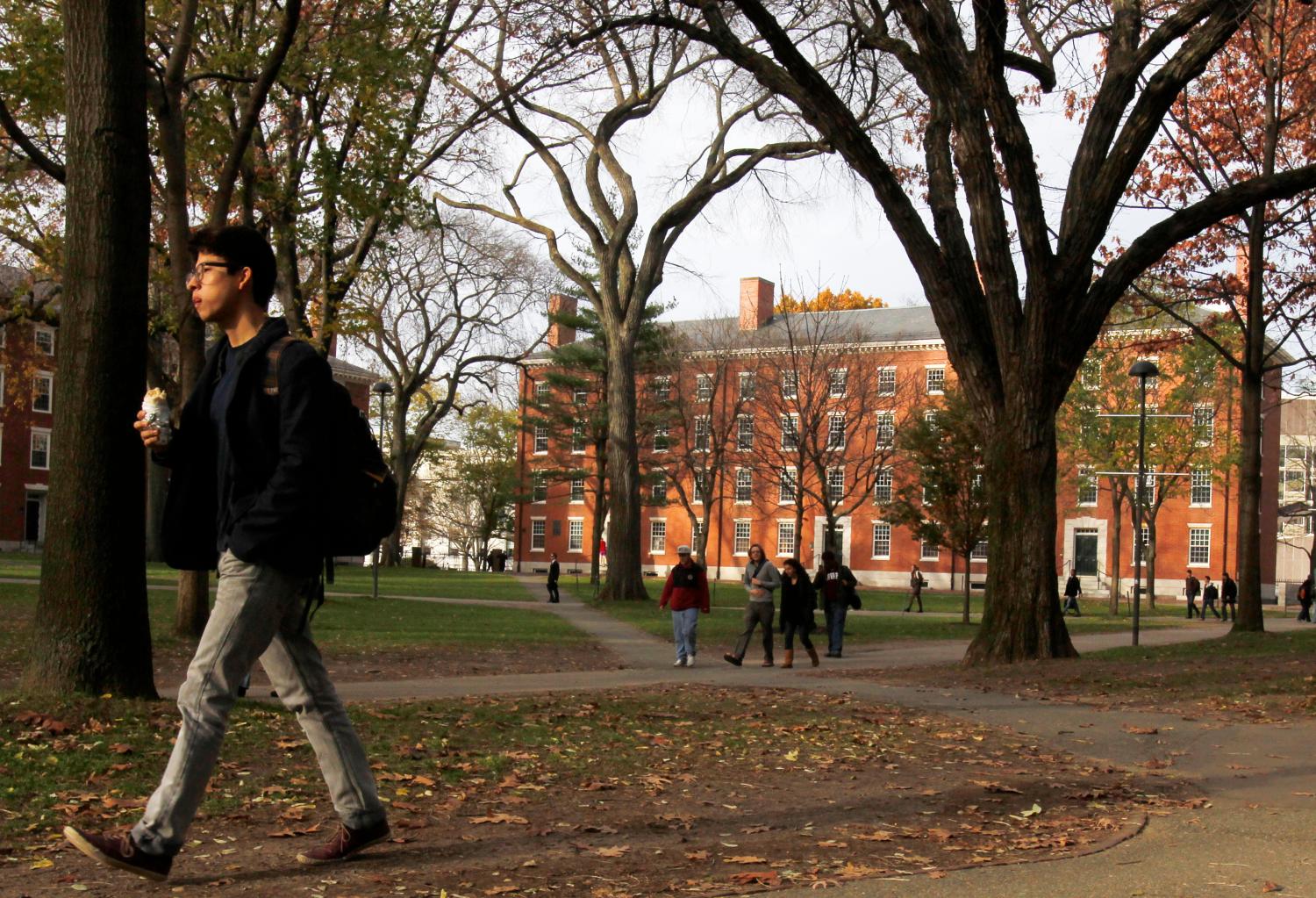 A man walks through Harvard Yard at Harvard University.