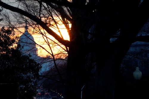 The sun rises over the U.S. Capitol.