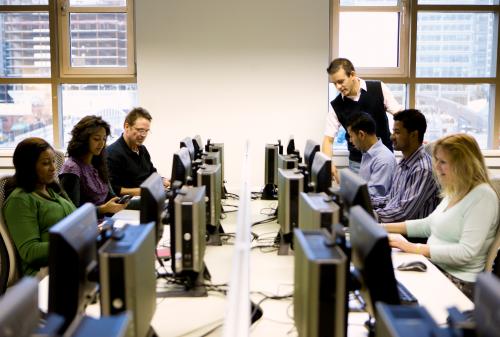 adult education: mature students working in a computer laboratory