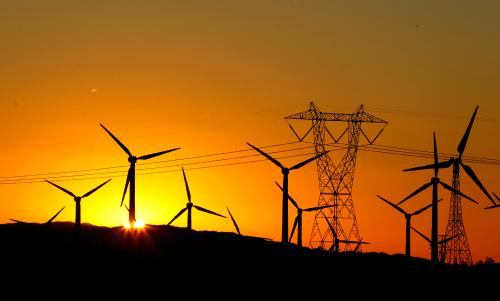 The sun rises behind windmills at a wind farm in Palm Springs, California, February 9, 2011.