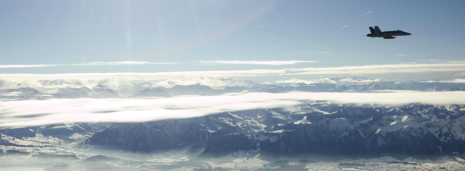 A Swiss Army FA-18 Hornet aircraft flies near Thun during an interception training, January 24, 2011. A maximum of 5000 Swiss soldiers will take part in the security operation called "Alpa Eco Undici" for the World Economic Forum Annual Meeting 2011 that is taking place in Davos January 26 to 30, 2011. REUTERS/Denis Balibouse (SWITZERLAND - Tags: MILITARY BUSINESS POLITICS) - BM2E71O152E01