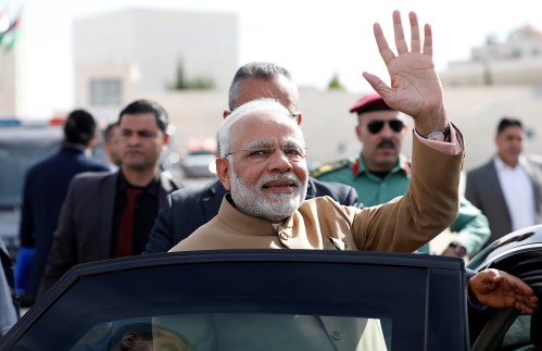 India's Prime Minister Narendra Modi waves upon his arrival to meet with Palestinian President Mahmoud Abbas (not pictured) in Ramallah, in the occupied West Bank February 10, 2018. REUTERS/Mohamad Torokman - RC1E60B31120