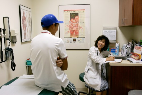 Internal medicine specialist Dr. Ingrid Chung (R) interviews her patient during a medical exam at her practice in Chantilly, Virginia, July 30, 2009. Public support for President Barack Obama's healthcare reform is waning, polls showed on Thursday as Congress wrangles over how to overhaul an industry that accounts for one-sixth of the U.S. economy.