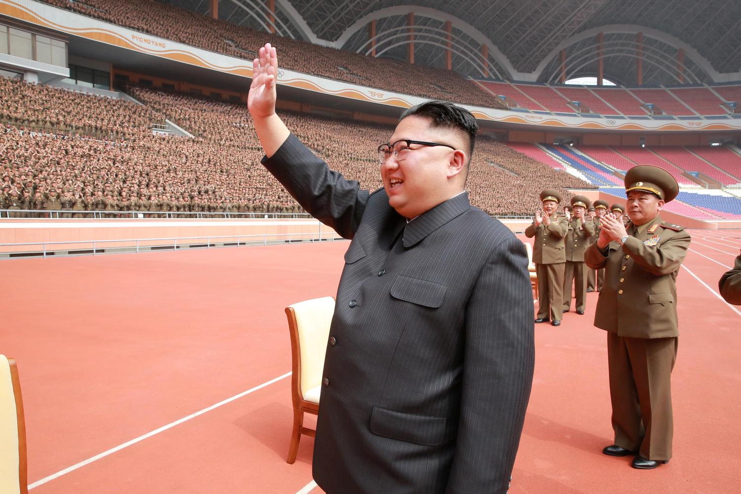 North Korean leader Kim Jong-un waves to the members of the Korean People's Army.