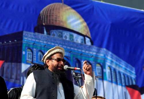 Hafiz Muhammad Saeed, chief of the Islamic charity organisation Jamaat-ud-Dawa, speaks to supporters during a gathering in Rawalpindi