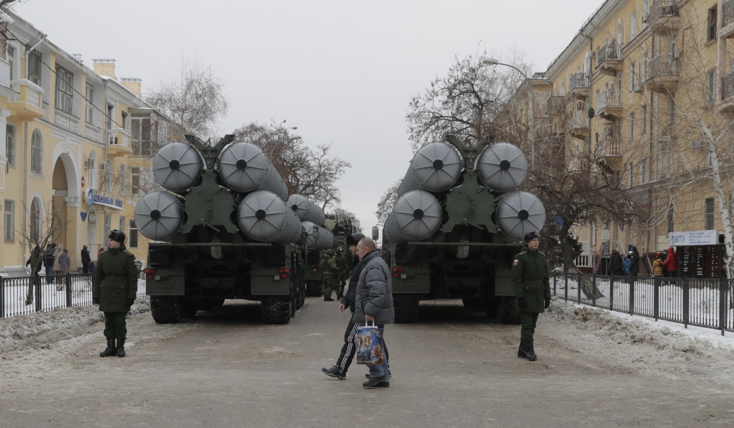 People walk past Russian S-400 missile air defence systems before the military parade to commemorate the 75th anniversary of the battle of Stalingrad in World War Two, in the city of Volgograd, Russia February 2, 2018. REUTERS/Tatyana Maleyeva - UP1EE220SDJ25