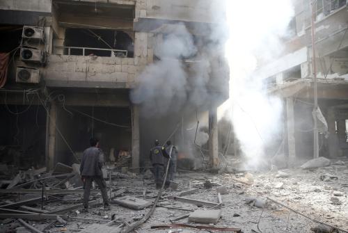 Smoke rises at a damaged site after an airstrike in the besieged town of Douma, Eastern Ghouta, Damascus, Syria February 9, 2018. REUTERS/Bassam Khabieh - RC1E74EFF970