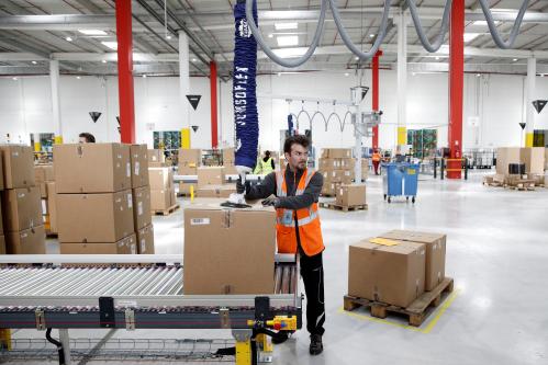 Employees at work at an Amazon factory.
