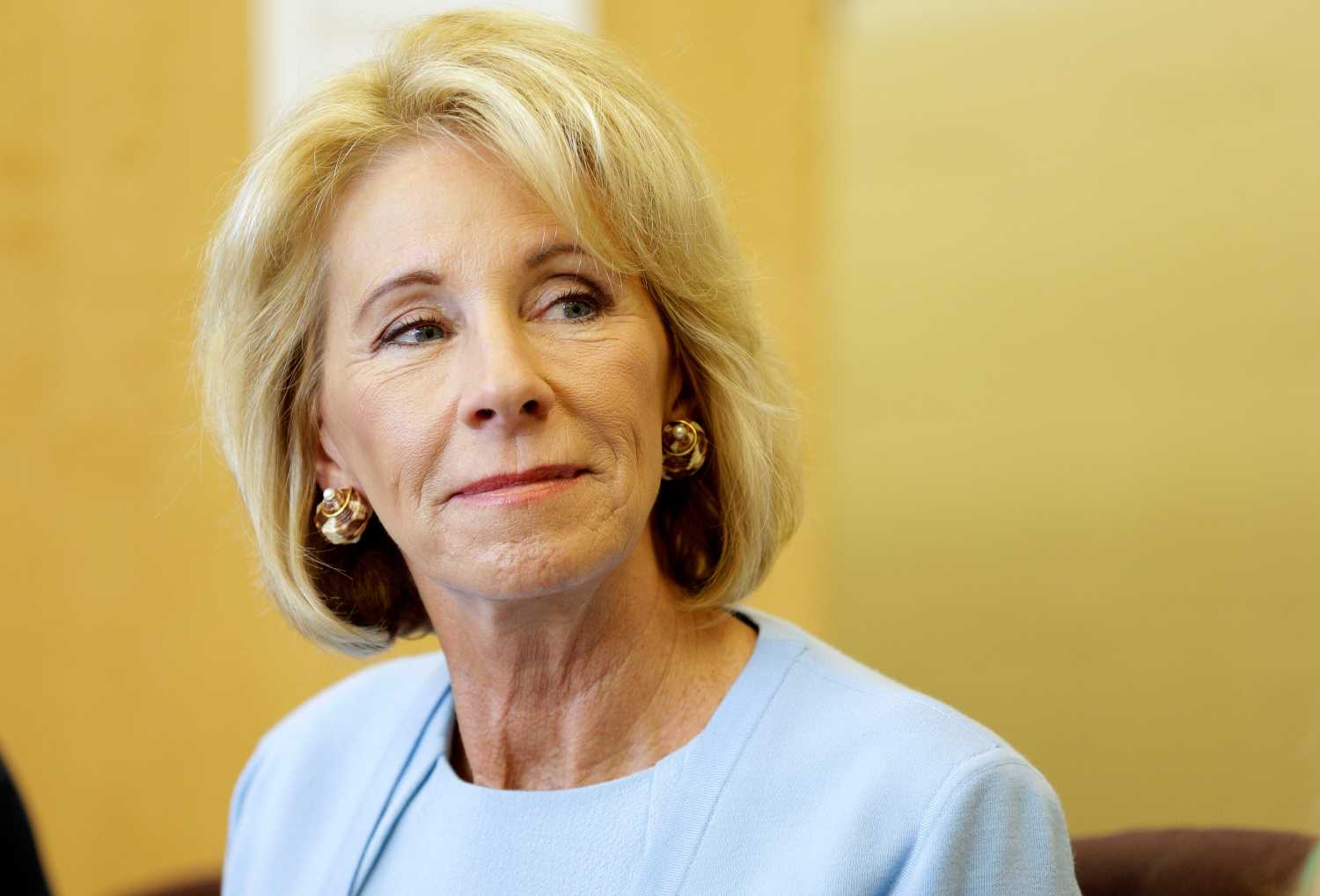 U.S. Secretary of Education Betsy DeVos listens to a presentation during a visit to the Excel Academy public charter school in Washington, U.S., April 5, 2017.