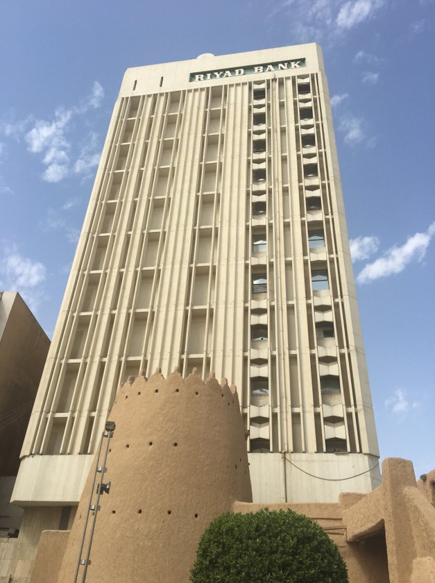 The old city of Riyadh was largely demolished in the 1950s, and thus the streets around Masmak Fort are now dominated by dissonant strings of dilapidated mid-century buildings. Here, a restored gateway from Riyadh’s old city wall stands before the mid-century modernist Riyadh Bank building.