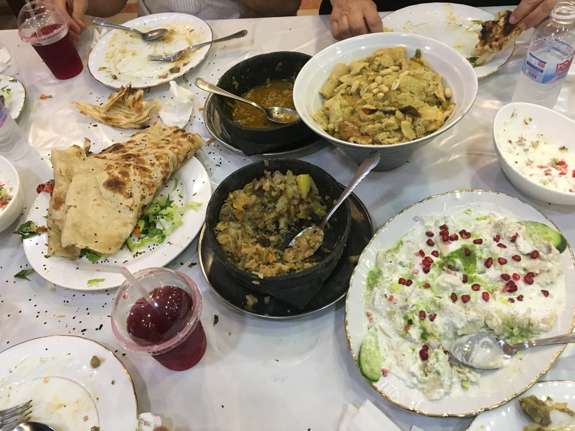After a walk through Jizan’s central souk (market), another amazing Yemeni-style dinner. In the souk, a little boy begged me for change; locals dismissed him, telling me, “huwa min Yemen” (“he’s from Yemen”). A local told me that there is child trafficking into Jizan from Yemen. I did not see evidence of a major refugee inflow (e.g. homeless or begging families in the souk), and locals spoke of cross-border migration as a longstanding feature of life here—indeed, some locals trace their ancestry to Yemen.