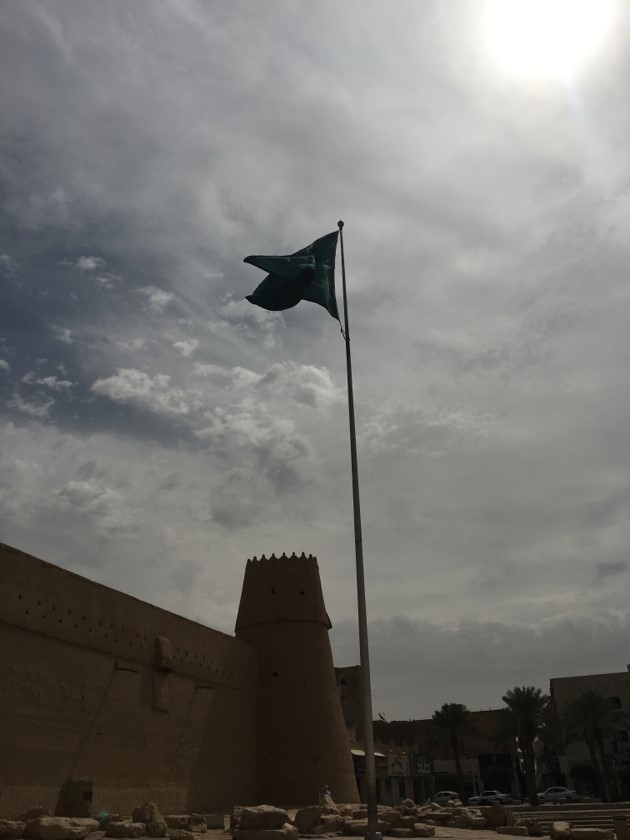 The Saudi flag flies over Masmak Fort in the center of Riyadh. Abdelaziz Al-Saud’s secret return from Kuwait to capture Masmak Fort in 1902 is seen as a key event in establishing the modern Saudi kingdom. The incident is extensively documented in the Fort’s permanent exhibit, including by a 1950s-era, ARAMCO-produced film that dramatically recreates the story.