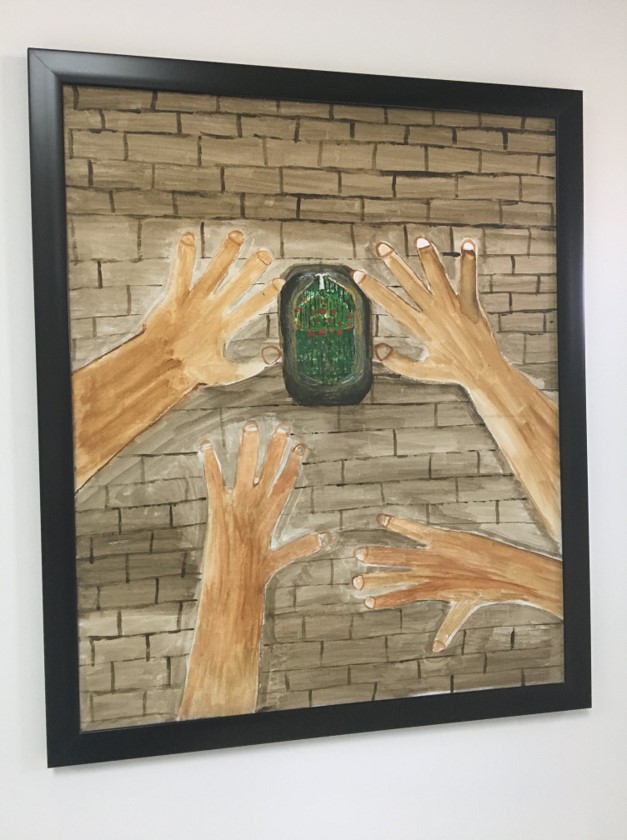 A painting made in art therapy by a “beneficiary” of the Mohamed bin Nayef Center for Counseling and Care (also known as the jihadi rehab center). The center is structured much like an addiction treatment facility, but the “illness” they treat is one that they describe as “intellectual deviation” into religious beliefs that justify terrorism. The program begins after prisoners complete their jail sentence, and works to reintegrate them into their families and communities.The 3,000 or so prisoners who have been through this program almost certainly saw gentler treatment than other jihadi prisoners, some of whom, human rights groups say, were tortured to elicit confessions.