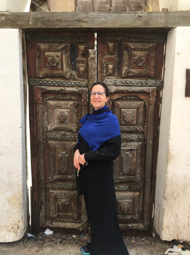 At the door of the single cistern that stored fresh water for the old city of Jeddah. Saudi law requires a woman to wear the black abaya robe whenever she is in a public area, but does not require a headscarf. Although norms are loosening, the vast majority of women I saw still wore black abaya, hijab (headscarf) and many wore the black niqab (face veil).