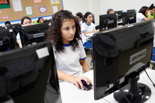 Children participate in a computing class at an Innova school in the outskirts of Lima