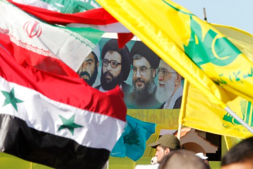 A poster of (R-L) Iran's supreme leader Ayatollah Ali Khamenei, Hezbollah Secretary-General Sayyed Hassan Nasrallah, former Hezbollah Secretary-General Sayyed Abbas al-Musawi and Lebanese resistance leader and cleric Sheikh Ragheb Harb, is seen in between Iranian, Syrian, Lebanese and Hezbollah flags during Resistance and Liberation Day celebrations in Bint Jbeil May 25, 2014. The event commemorates the 14th anniversary of Israel's withdrawal from southern Lebanon. REUTERS/Ali Hashisho A poster of (R-L) Iran's supreme leader Ayatollah Ali Khamenei, Hezbollah Secretary-General Sayyed Hassan Nasrallah, former Hezbollah Secretary-General Sayyed Abbas al-Musawi and Lebanese resistance leader and cleric Sheikh Ragheb Harb, is seen in between Iranian, Syrian, Lebanese and Hezbollah flags during Resistance and Liberation Day celebrations in Bint Jbeil May 25, 2014. The event commemorates the 14th anniversary of Israel's withdrawal from southern Lebanon. REUTERS/Ali Hashisho