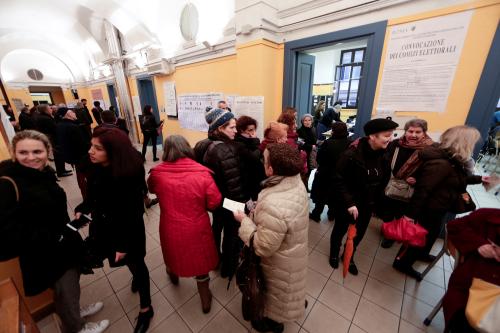 People wait in a line to vote at a polling station in Rome, Italy March 4, 2018. REUTERS/Yara Nardi