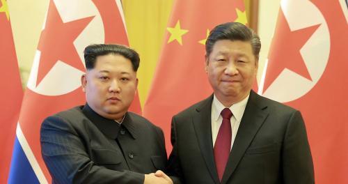 North Korean leader Kim Jong Un shakes hands with Chinese President Xi Jinping as he paid an unofficial visit to Beijing, China, in this undated photo released by North Korea's Korean Central News Agency (KCNA) in Pyongyang March 28, 2018. KCNA/via Reuters ATTENTION EDITORS - THIS IMAGE WAS PROVIDED BY A THIRD PARTY. REUTERS IS UNABLE TO INDEPENDENTLY VERIFY THIS IMAGE. NO THIRD PARTY SALES. NOT FOR USE BY REUTERS THIRD PARTY DISTRIBUTORS. SOUTH KOREA OUT. NO COMMERCIAL OR EDITORIAL SALES IN SOUTH KOREA. - RC1D5C17BC70