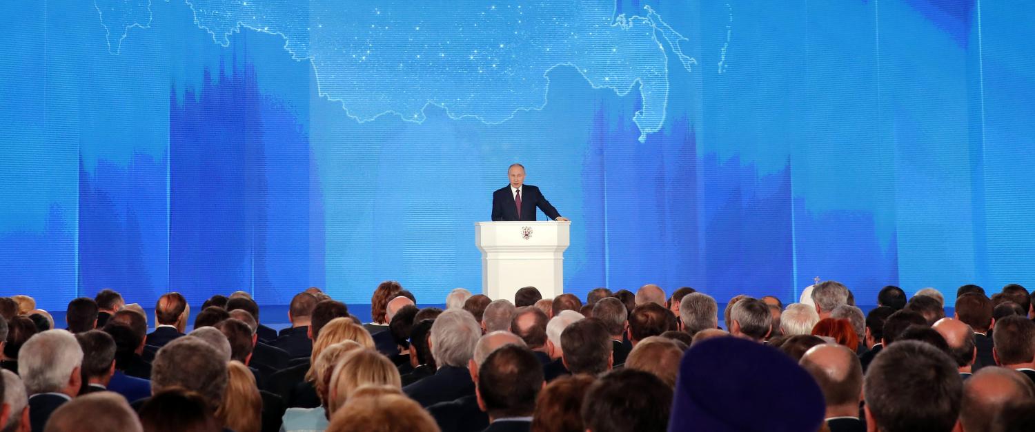 Russian President Vladimir Putin addresses the Federal Assembly, including the State Duma parliamentarians, members of the Federation Council, regional governors and other high-ranking officials, in Moscow, Russia March 1, 2018. REUTERS/Maxim Shemetov TPX IMAGES OF THE DAY - RC1AA545C520